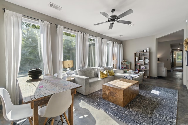 living area with concrete floors, visible vents, ceiling fan, and recessed lighting