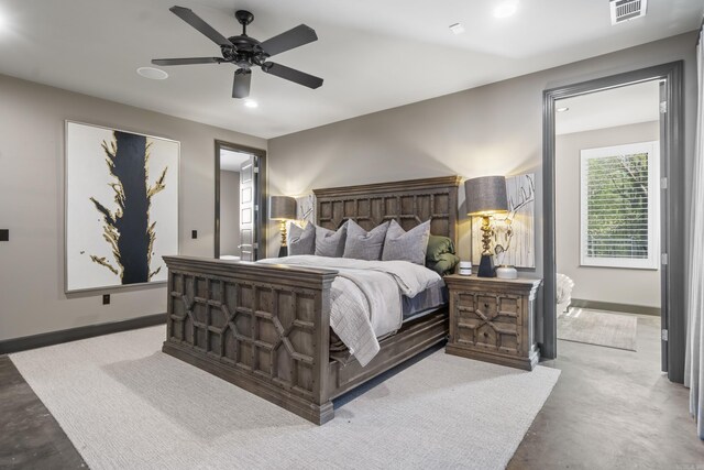 bedroom featuring concrete floors, visible vents, and baseboards