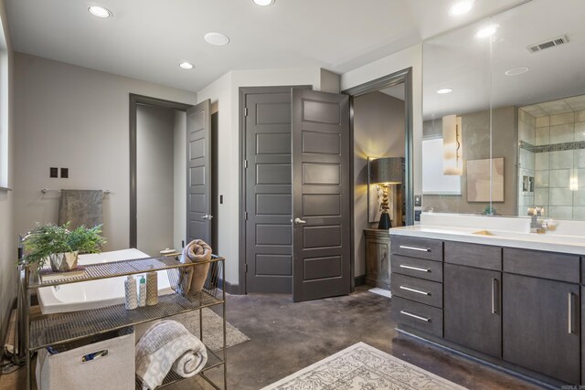 full bath featuring concrete floors, vanity, visible vents, and recessed lighting