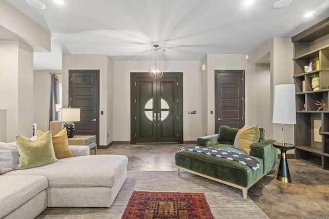 living room featuring baseboards, recessed lighting, and finished concrete floors