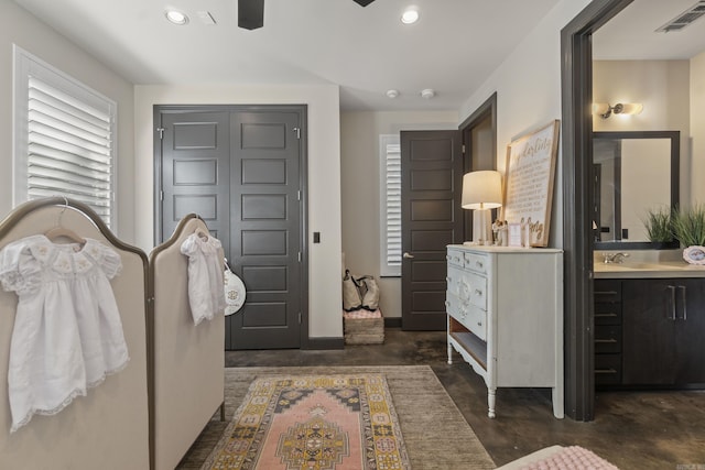 bedroom with recessed lighting, concrete floors, visible vents, and baseboards
