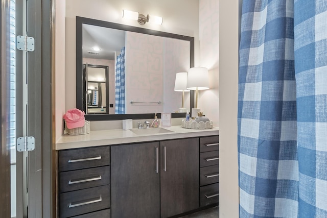 full bathroom featuring vanity and a shower with shower curtain