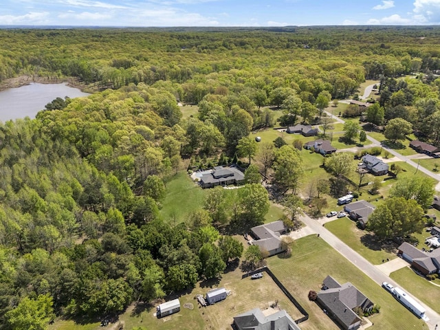 bird's eye view with a water view and a view of trees