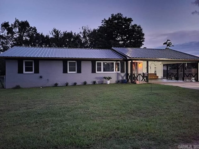 1139 Crescent Dr, Mena, AR 71953 - ranch-style house with concrete driveway, metal roof, a front yard, and an attached carport