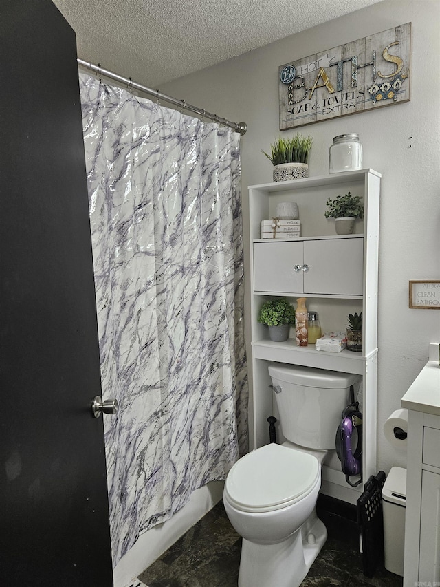 1139 Crescent Dr, Mena, AR 71953 - full bathroom featuring a textured ceiling, vanity, toilet, marble finish floor, and a shower with shower curtain
