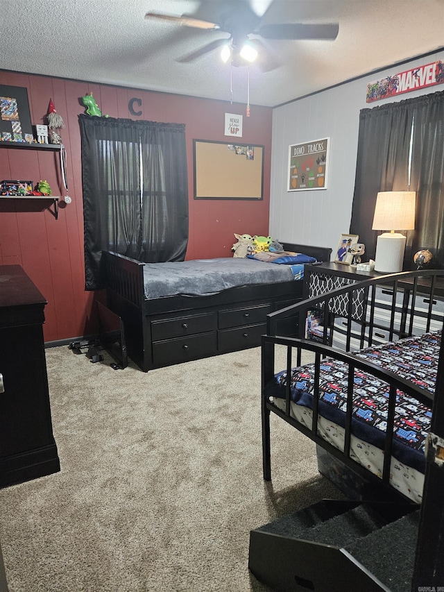 1139 Crescent Dr, Mena, AR 71953 - bedroom featuring a ceiling fan, carpet, and a textured ceiling