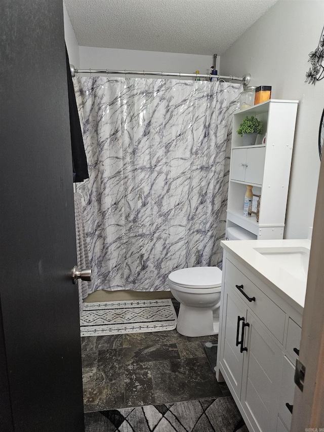 1139 Crescent Dr, Mena, AR 71953 - bathroom with toilet, a textured ceiling, vanity, and a shower with shower curtain