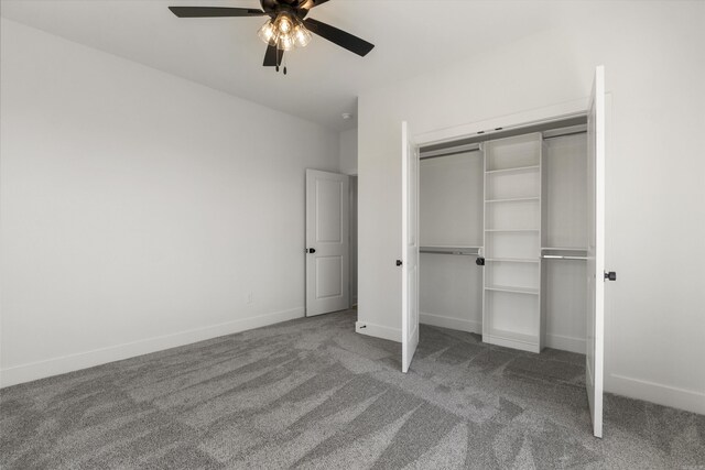 unfurnished bedroom with a closet, ceiling fan, baseboards, and carpet floors