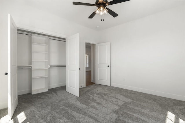 unfurnished bedroom featuring carpet floors, baseboards, a closet, and ceiling fan