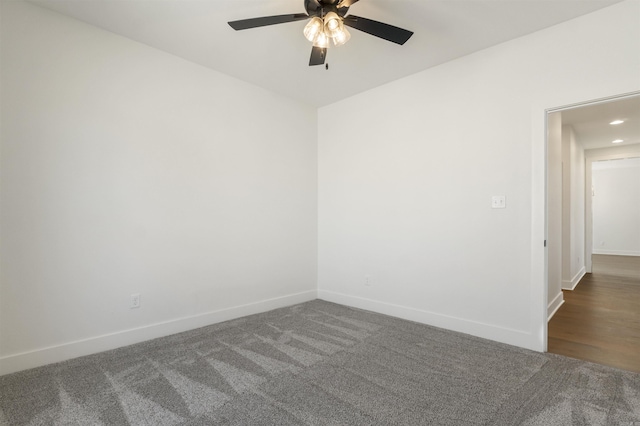 carpeted spare room featuring recessed lighting, baseboards, and a ceiling fan