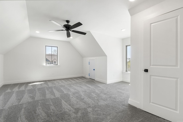 bonus room featuring baseboards, a ceiling fan, carpet, and lofted ceiling