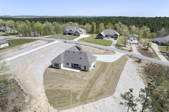 bird's eye view featuring a view of trees
