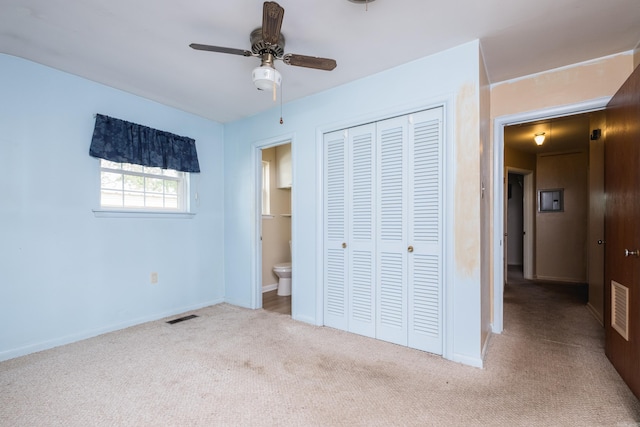 unfurnished bedroom with visible vents, baseboards, a closet, and carpet floors
