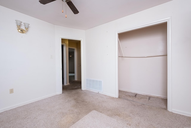 unfurnished bedroom with visible vents, baseboards, a ceiling fan, and carpet