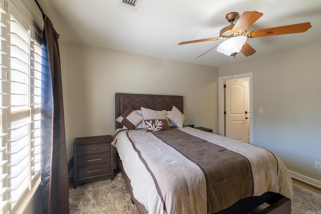 bedroom with visible vents, ceiling fan, and baseboards
