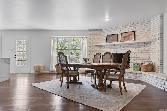 dining area featuring baseboards and dark wood finished floors