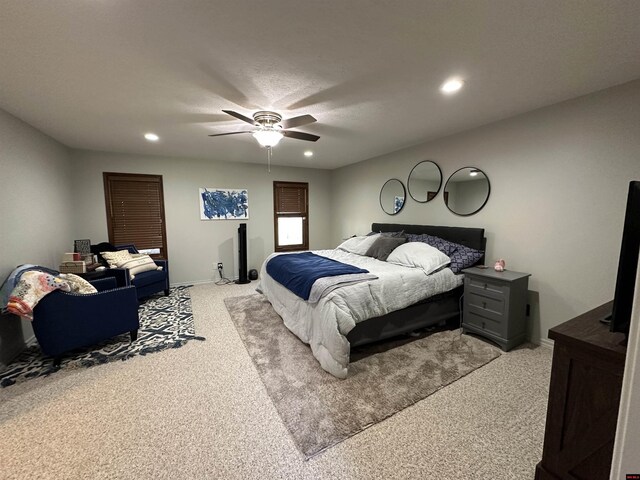 bedroom with baseboards, recessed lighting, light colored carpet, and a ceiling fan