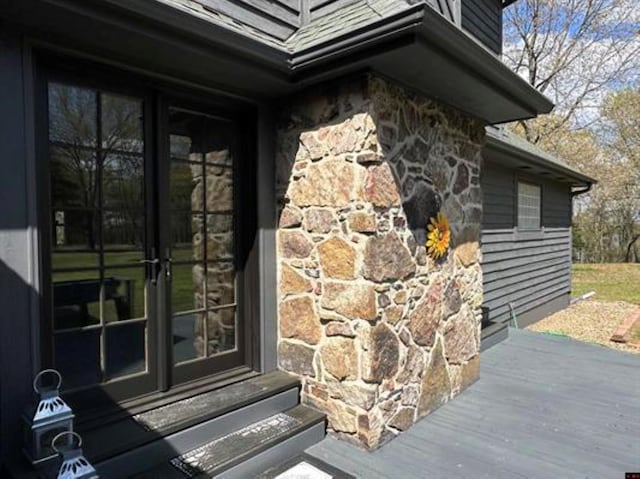 entrance to property with stone siding
