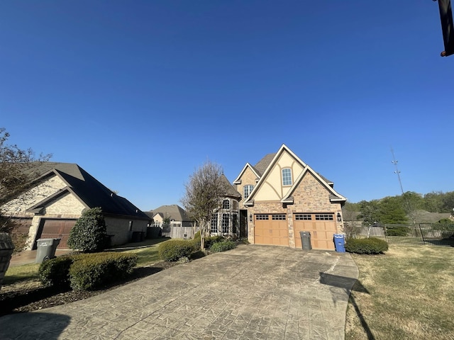 4505 Kalli Dr, Jonesboro, AR 72404 - craftsman inspired home with fence, stone siding, and driveway