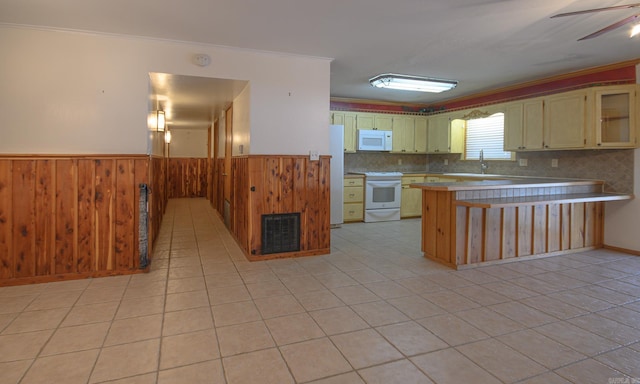 1295 Polk Road 47, Mena, AR 71953 - kitchen featuring visible vents, white appliances, a peninsula, crown molding, and wainscoting