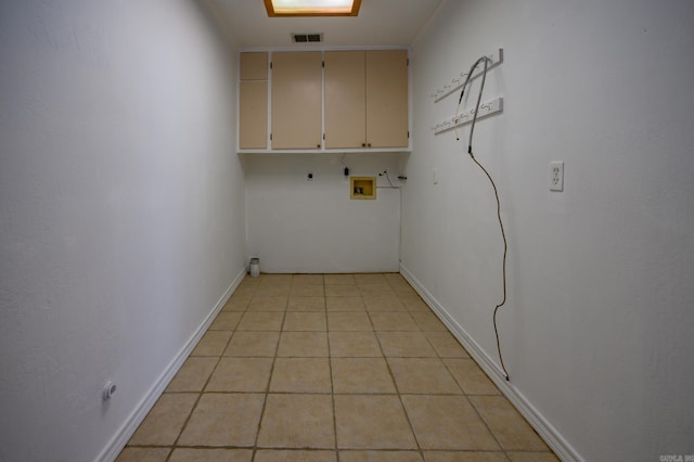 1295 Polk Road 47, Mena, AR 71953 - laundry area with visible vents, light tile patterned floors, washer hookup, hookup for an electric dryer, and cabinet space