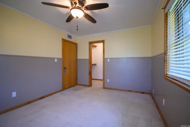1295 Polk Road 47, Mena, AR 71953 - unfurnished room featuring baseboards, ornamental molding, visible vents, ceiling fan, and light colored carpet