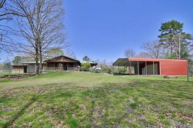 1295 Polk Road 47, Mena, AR 71953 - view of yard featuring a carport