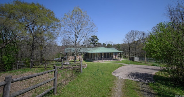1295 Polk Road 47, Mena, AR 71953 - exterior space featuring covered porch, metal roof, a front yard, fence, and driveway