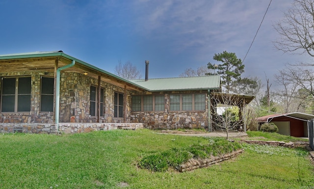 1295 Polk Road 47, Mena, AR 71953 - view of property exterior with a yard, metal roof, and stone siding