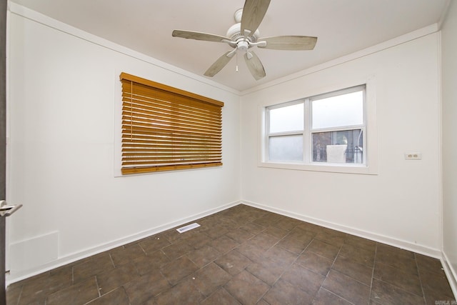 unfurnished room featuring visible vents, baseboards, and a ceiling fan