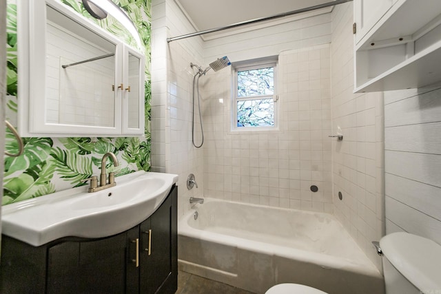 full bathroom with toilet, vanity, and tub / shower combination