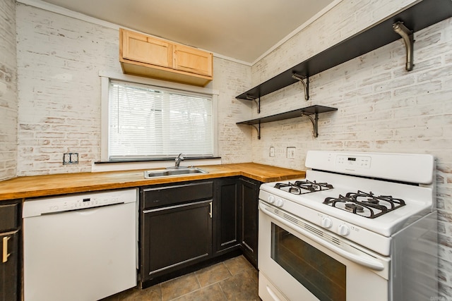 kitchen featuring white appliances, stone finish floor, open shelves, a sink, and wood counters