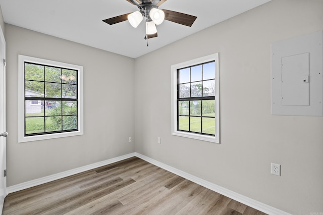 1216 Wade Ave, Judsonia, AR 72081 - empty room with baseboards, light wood-type flooring, electric panel, and a ceiling fan