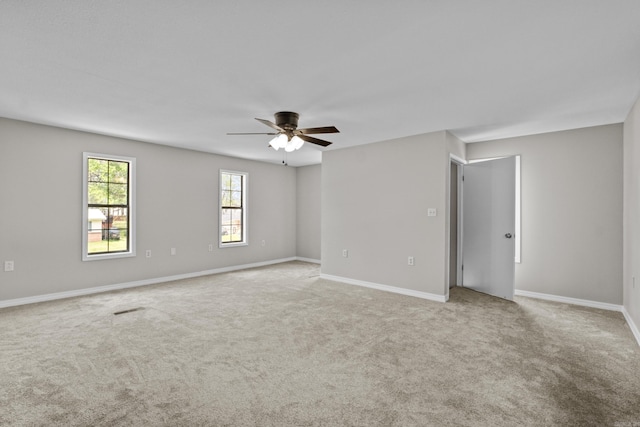 1216 Wade Ave, Judsonia, AR 72081 - unfurnished room with carpet floors, ceiling fan, and baseboards