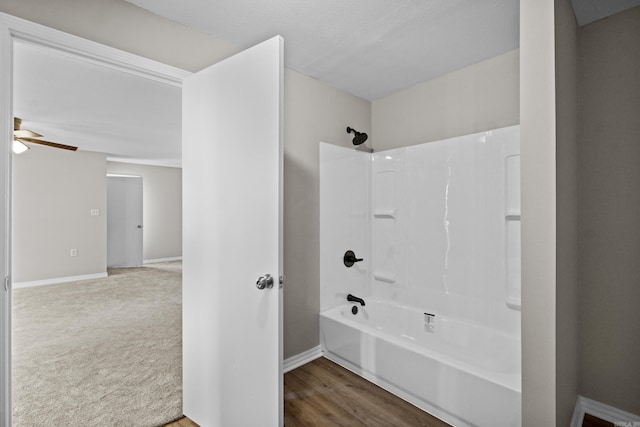 1216 Wade Ave, Judsonia, AR 72081 - bathroom with a ceiling fan, baseboards, and bathtub / shower combination