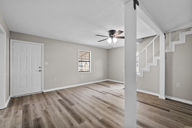 1216 Wade Ave, Judsonia, AR 72081 - interior space with stairway, baseboards, a ceiling fan, and wood finished floors
