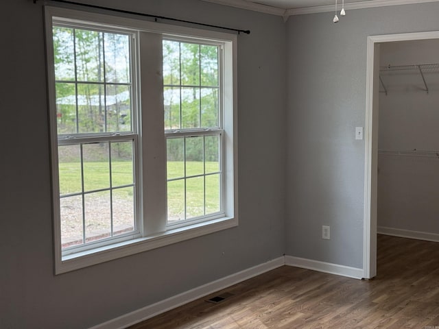 5301 Owensville Cutoff, Lonsdale, AR 72087 - empty room featuring crown molding, wood finished floors, and baseboards