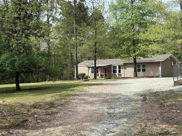 5301 Owensville Cutoff, Lonsdale, AR 72087 - exterior space featuring a front lawn and covered porch
