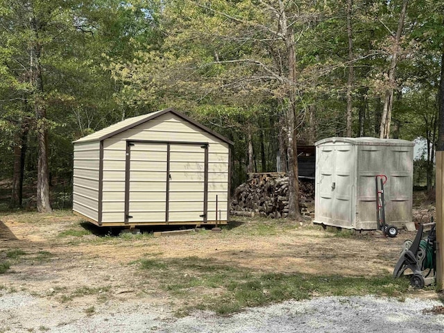 5301 Owensville Cutoff, Lonsdale, AR 72087 - view of shed featuring a wooded view