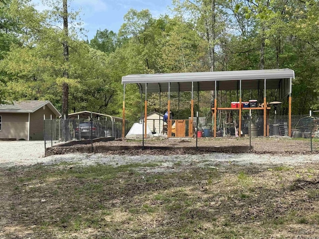 5301 Owensville Cutoff, Lonsdale, AR 72087 - exterior space with a carport, fence, and an outdoor structure