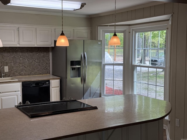 5301 Owensville Cutoff, Lonsdale, AR 72087 - kitchen featuring pendant lighting, white cabinets, black appliances, light countertops, and backsplash
