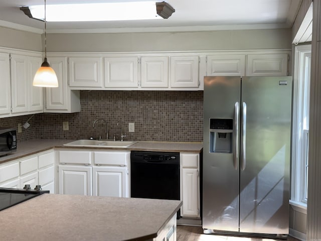 5301 Owensville Cutoff, Lonsdale, AR 72087 - kitchen with tasteful backsplash, white cabinets, a sink, black appliances, and pendant lighting