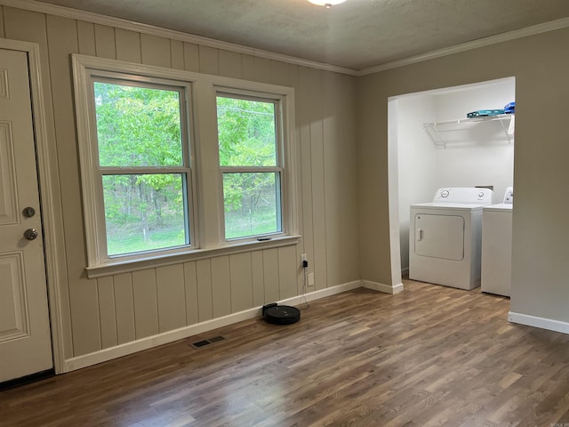 5301 Owensville Cutoff, Lonsdale, AR 72087 - washroom with baseboards, ornamental molding, visible vents, washing machine and clothes dryer, and wood finished floors
