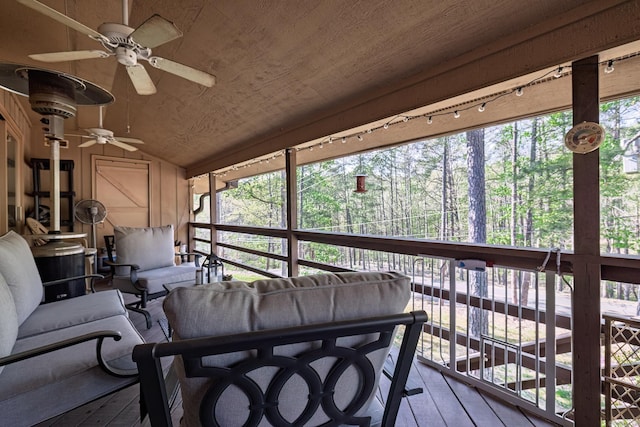 sunroom with an outdoor hangout area and a ceiling fan