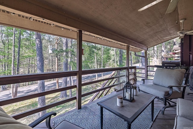 exterior space featuring a ceiling fan