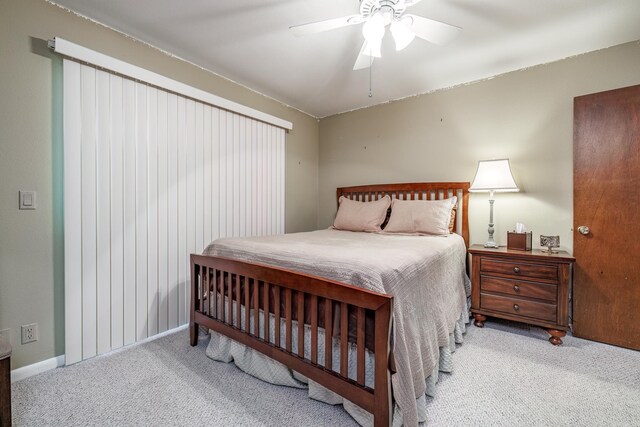 bedroom featuring ceiling fan, carpet flooring, and baseboards