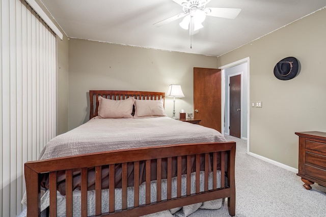 bedroom with baseboards, ceiling fan, and carpet