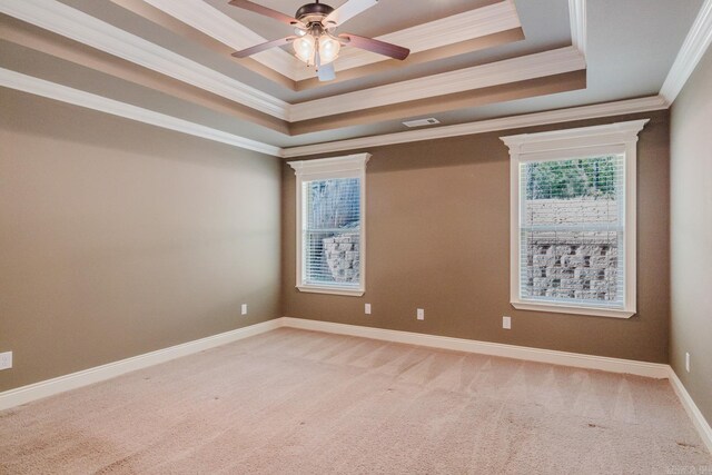 1844 White Oak Cir, Benton, AR 72019 - empty room with a raised ceiling, crown molding, visible vents, ceiling fan, and light colored carpet
