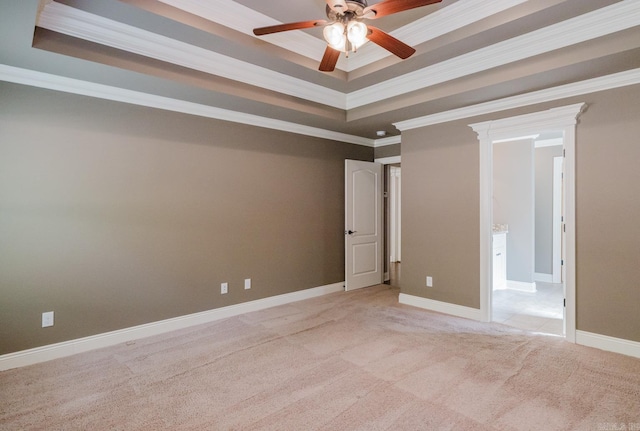 1844 White Oak Cir, Benton, AR 72019 - unfurnished room with baseboards, ornamental molding, light carpet, a ceiling fan, and a tray ceiling