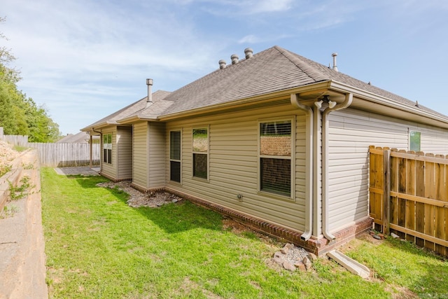 1844 White Oak Cir, Benton, AR 72019 - view of side of property with fence, a lawn, and roof with shingles